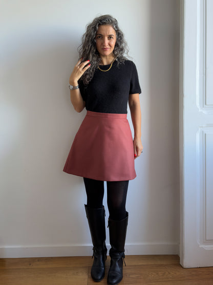 Karlie Skort sewing pattern, view A in the longer length in rust wool, front view with tights and boots